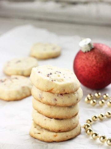 A stack of cranberry orange shortbread cookies
