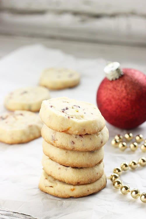 A stack of cranberry orange shortbread cookies