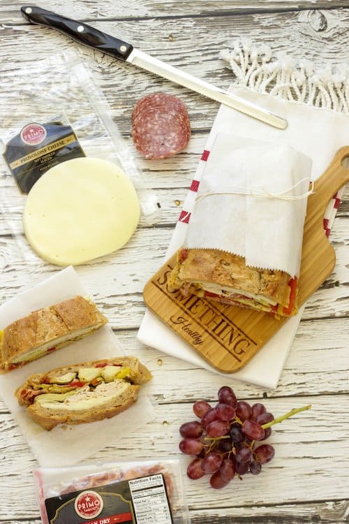 Overhead shot of Italian PIcnic Sandwiches with packages of meats and cheeses