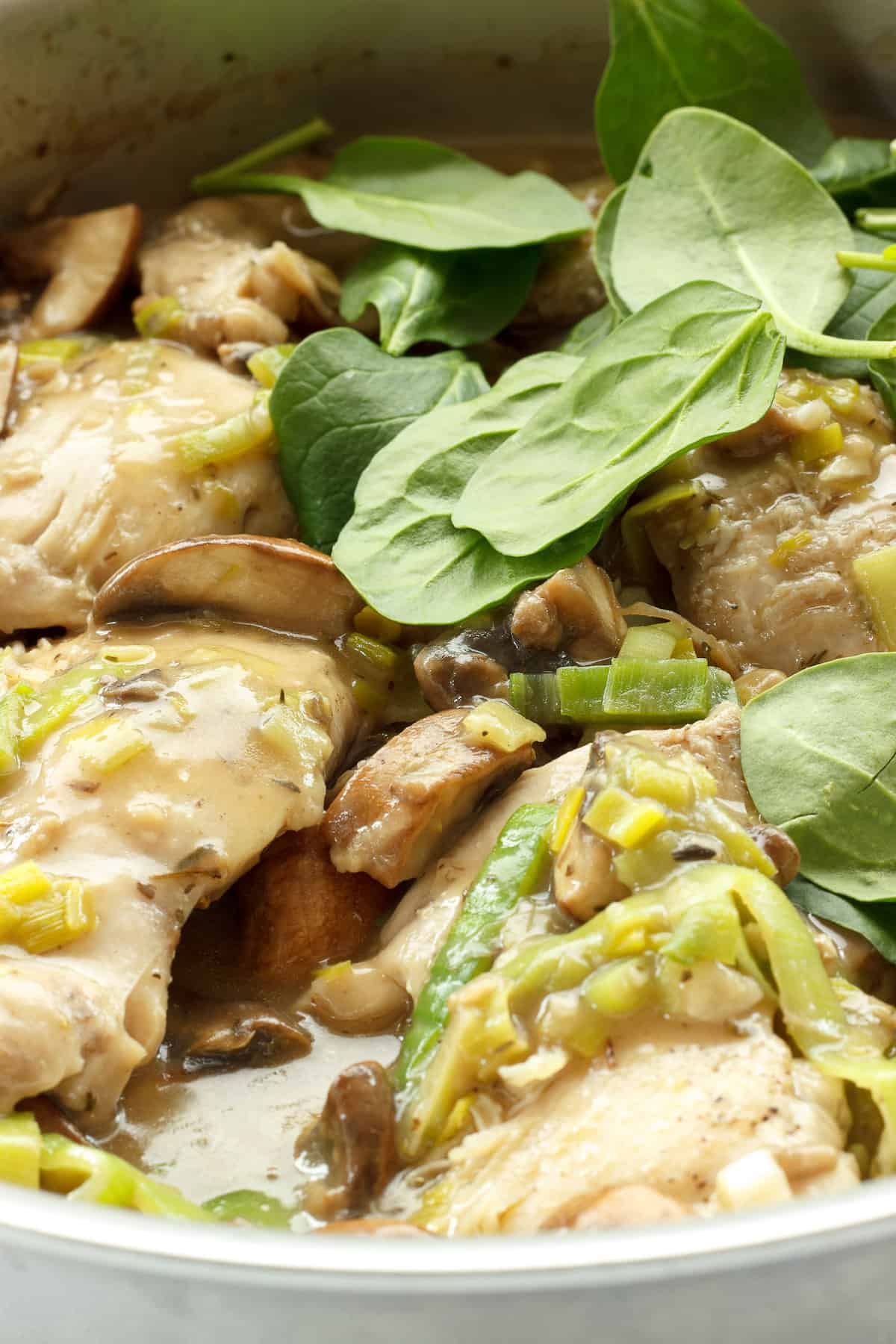Instructions to make chicken with spinach and mushrooms.  Spinach added to the skillet at the end.