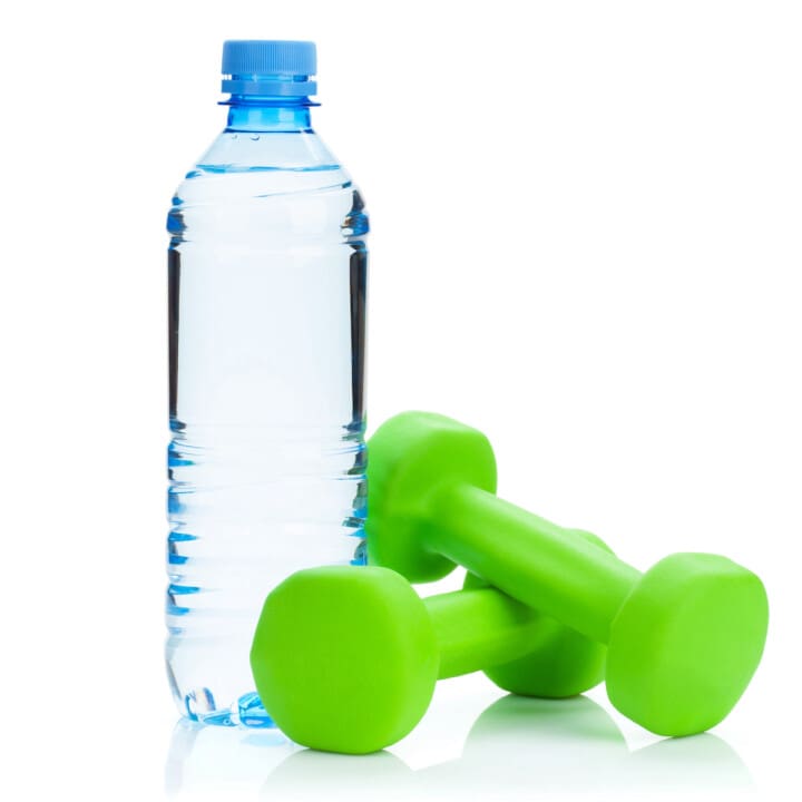 Two green dumbells and water bottle.