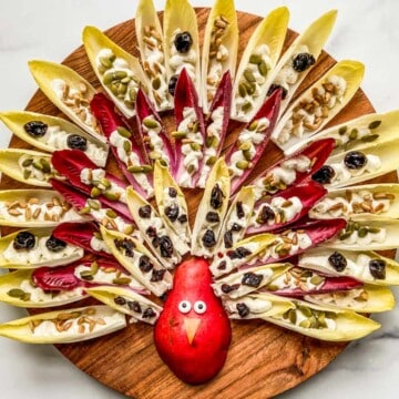 Thanksgiving appetizer board shaped like a turkey.